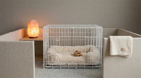 A high-quality photo of a luxurious and aesthetic puppy crate and playpen area, featuring a plush bed, salt lamp, and clean linen fencing for surviving the first month with a new puppy